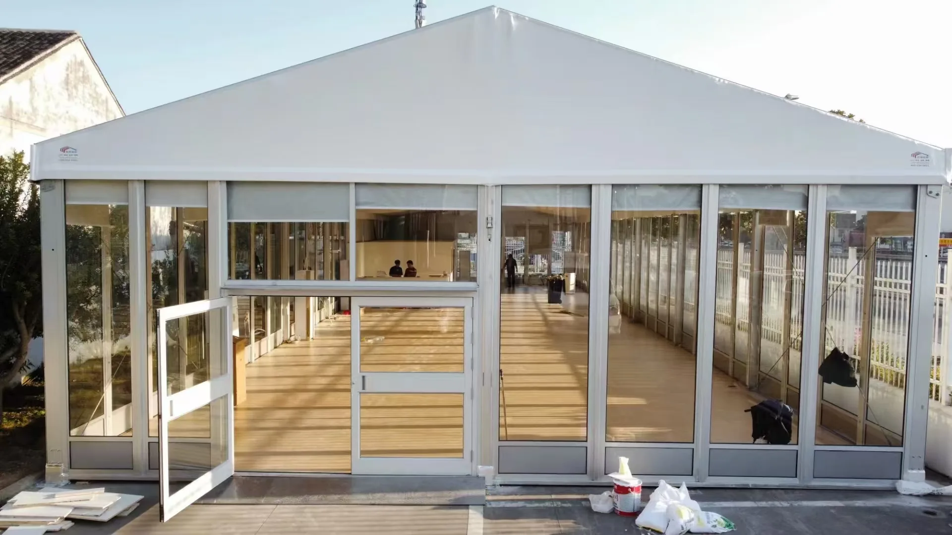 Glass-wall tent for a vehicle event