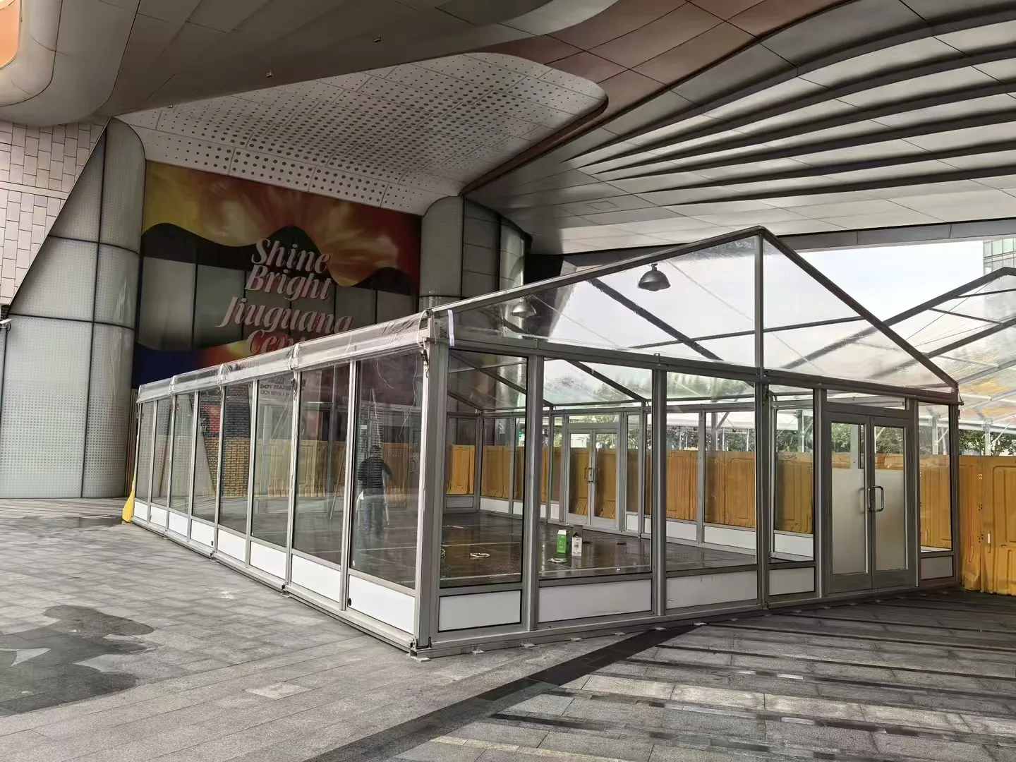 Outdoor tent with glass wall enclosure