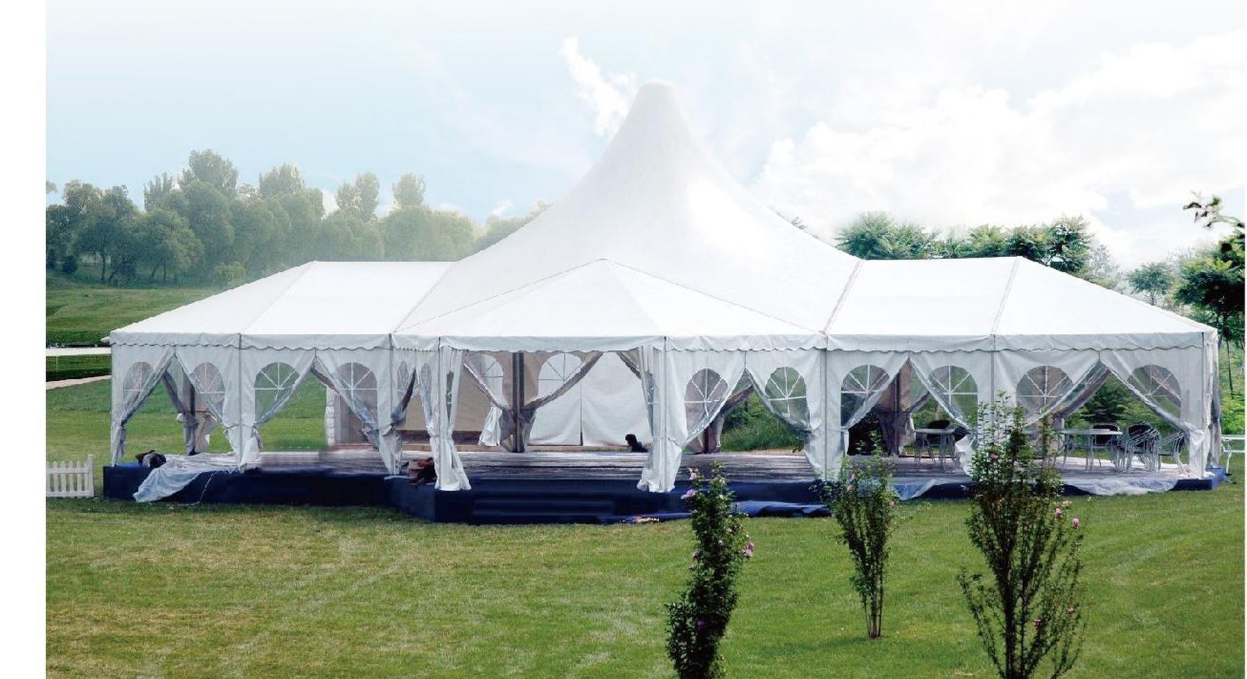White event tent installed on lawn
